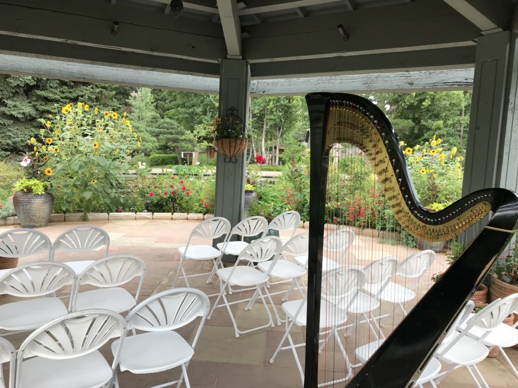 Barbara Lepke-Sims plays wedding harp music at the Monet garden in Denver, Colorado.