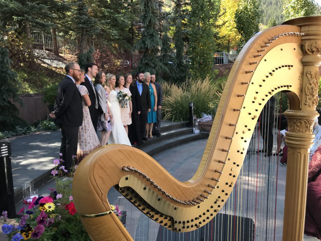 Barbara playing wedding harp music at the St. Regis in Aspen.